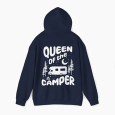 Back of a dark blue hoodie with the text 'Queen of the Camper' surrounded by elements including a camping van, stars, trees, and a campfire, on a plain background.