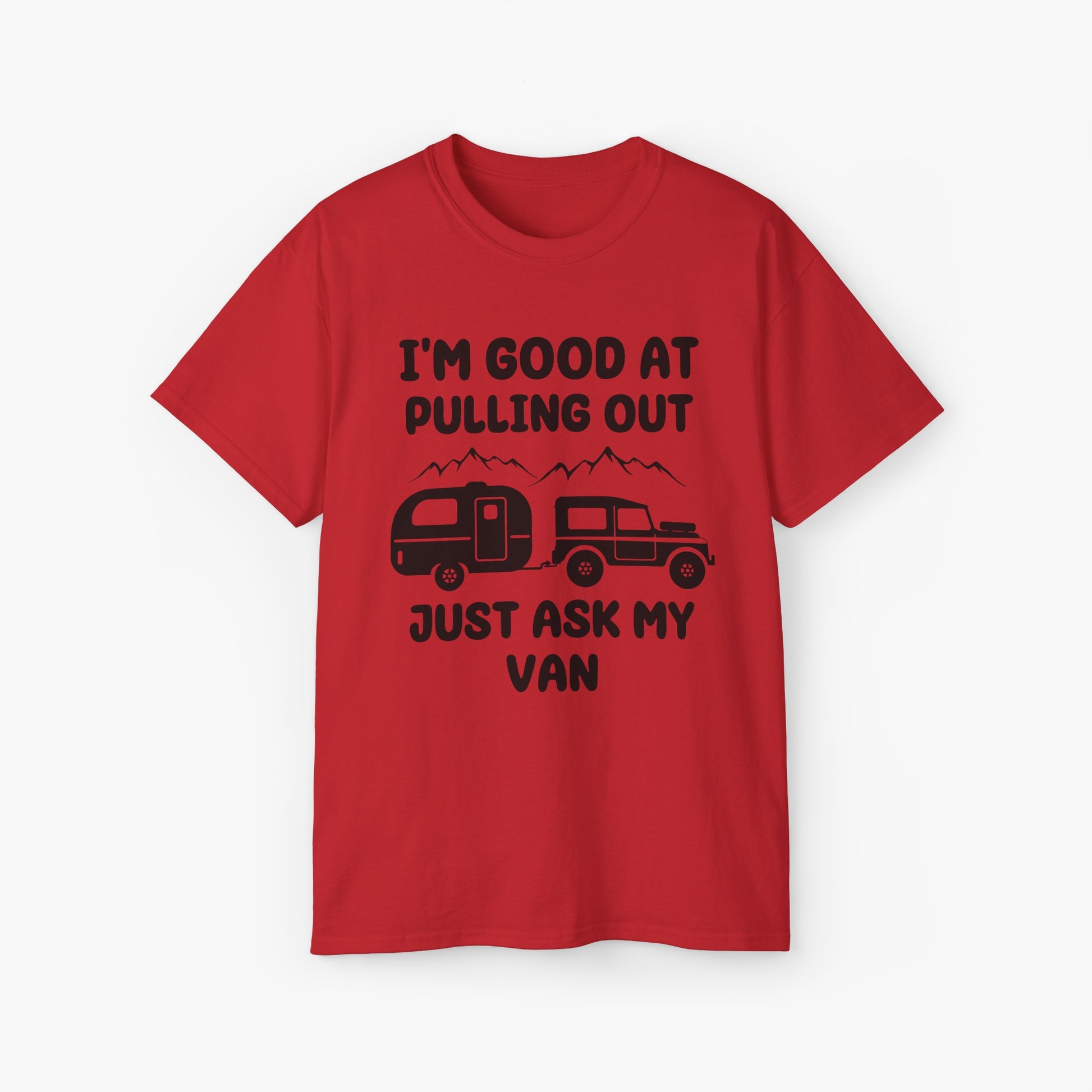 Red t-shirt with humorous text 'I'm good at pulling out, just ask my van,' featuring an image of a truck pulling a camping van, set against mountains on a plain background.