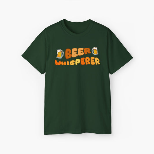 Green t-shirt featuring the colorful text 'Beer Whisperer' with two cartoon-style beer mugs, displayed on a plain background.