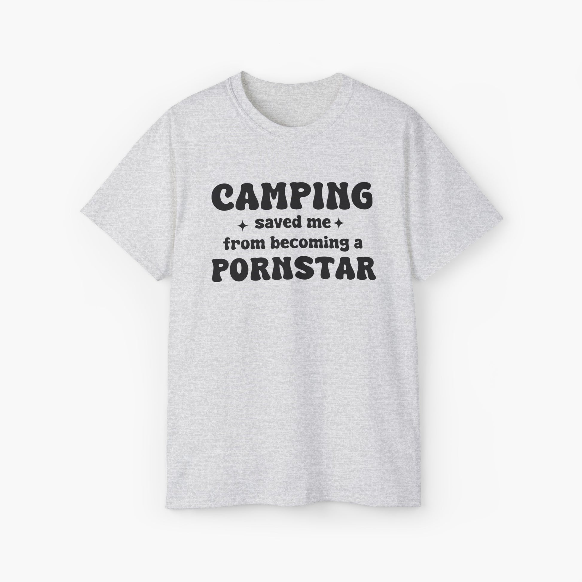 Light grey t-shirt with the bold statement 'Camping saved me from becoming a pornstar,' embellished with stars on a plain background.