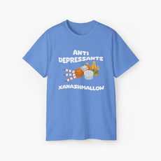 Light blue t-shirt with 'Anti Depressants, Xanashmallow' text, depicting an open remedies box filled with marshmallows, alongside a tent and trees.