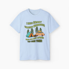 Light blue t-shirt with the text 'I have crazy camping buddies and I am not afraid to use them,' featuring a camping van, campfire, trees, and a tent.