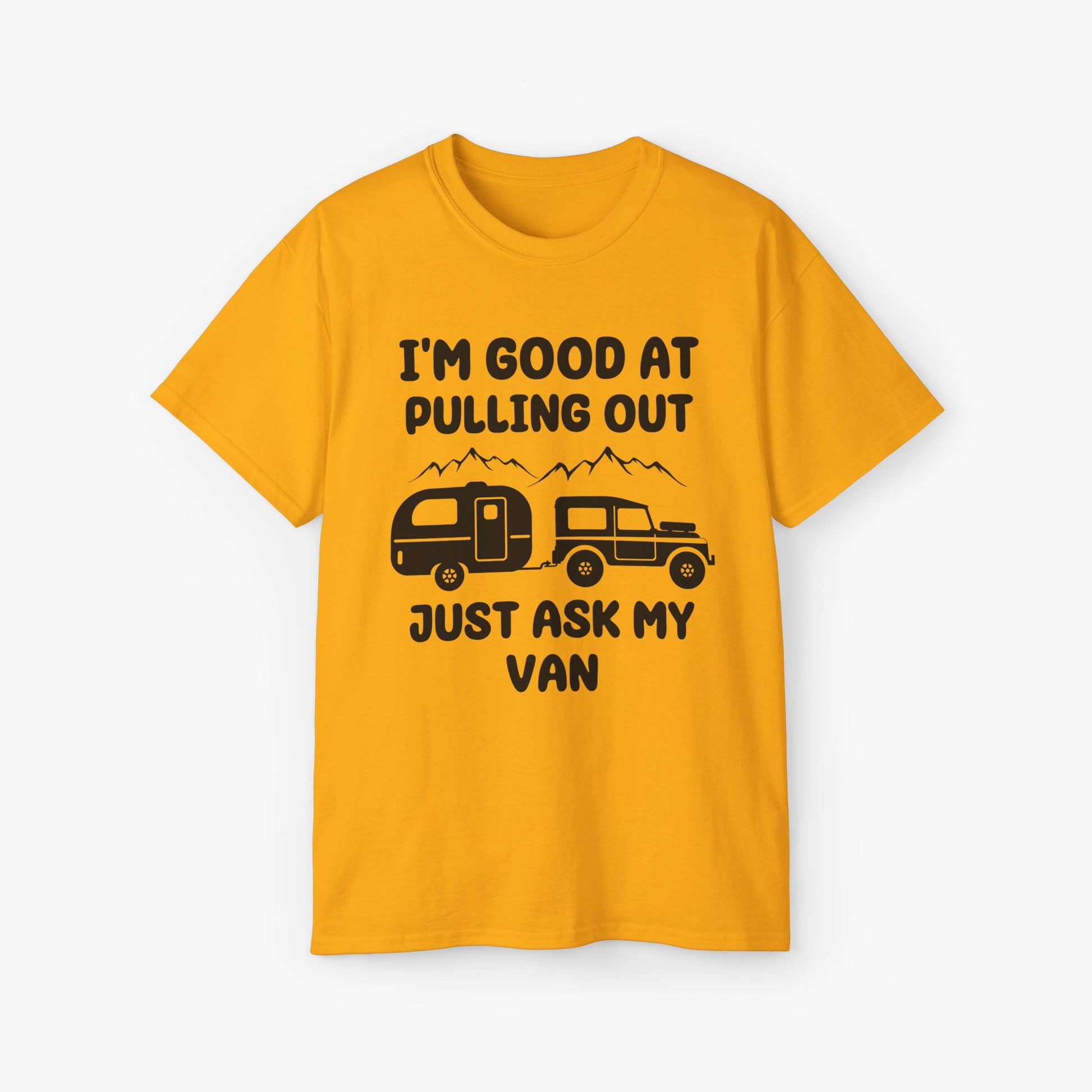 Yellow t-shirt with humorous text 'I'm good at pulling out, just ask my van,' featuring an image of a truck pulling a camping van, set against mountains on a plain background.