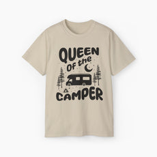 Sand color t-shirt with 'Camping Queen' text, illustrated with a camping van, stars, trees, campfire, and moon, on a plain background.