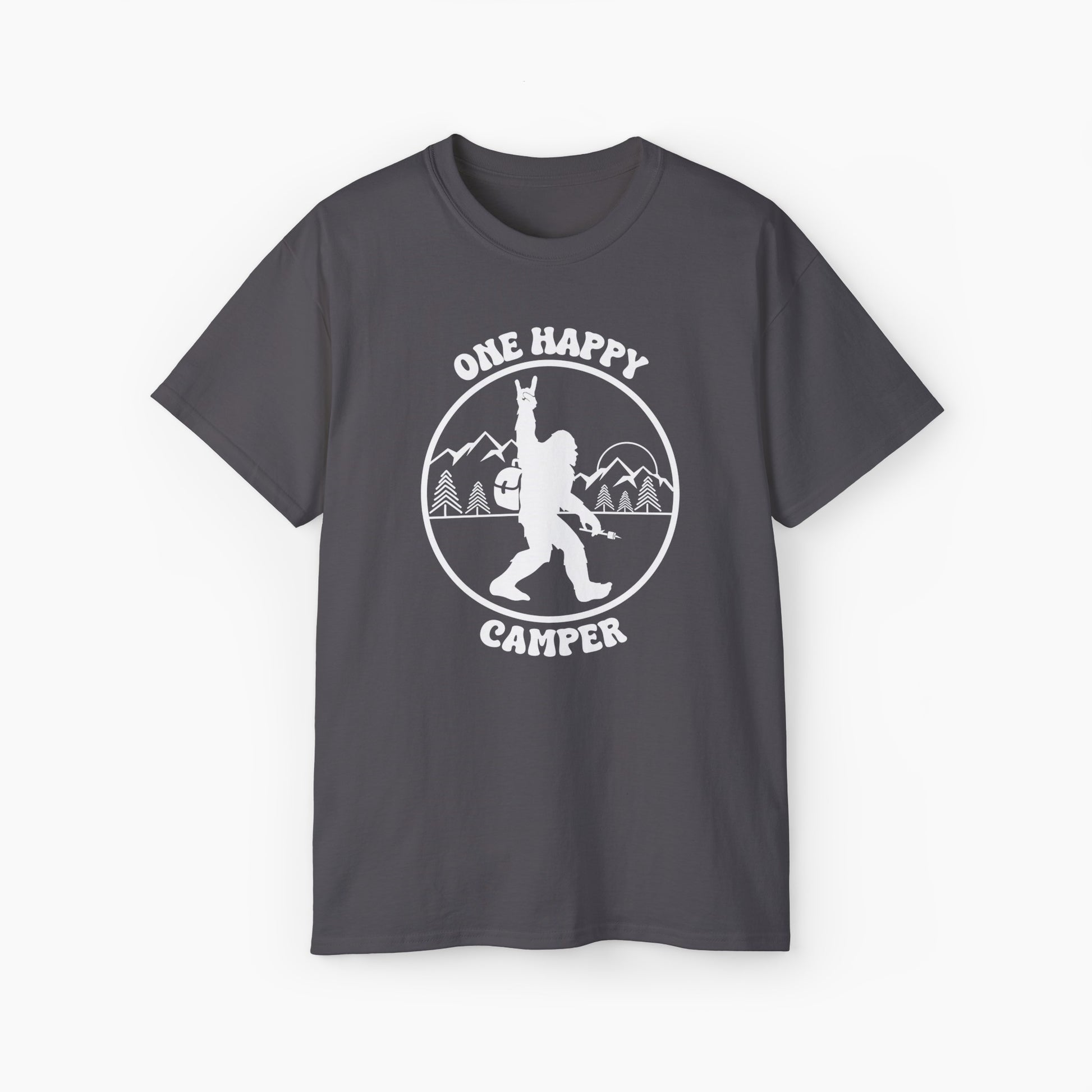 Dark grey t-shirt with 'One Happy Camper' text, featuring Bigfoot making a peace sign, set against a subtle background of trees and mountains.