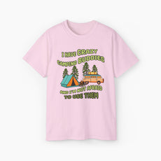 Light pink t-shirt with the text 'I have crazy camping buddies and I am not afraid to use them,' featuring a camping van, campfire, trees, and a tent.