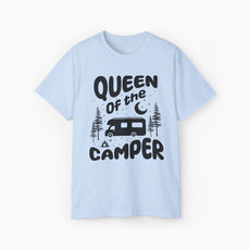 Light blue t-shirt with 'Camping Queen' text, illustrated with a camping van, stars, trees, campfire, and moon, on a plain background.