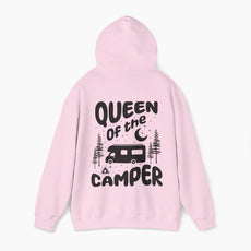 Back of a light pink hoodie with the text 'Queen of the Camper' surrounded by elements including a camping van, stars, trees, and a campfire, on a plain background.
