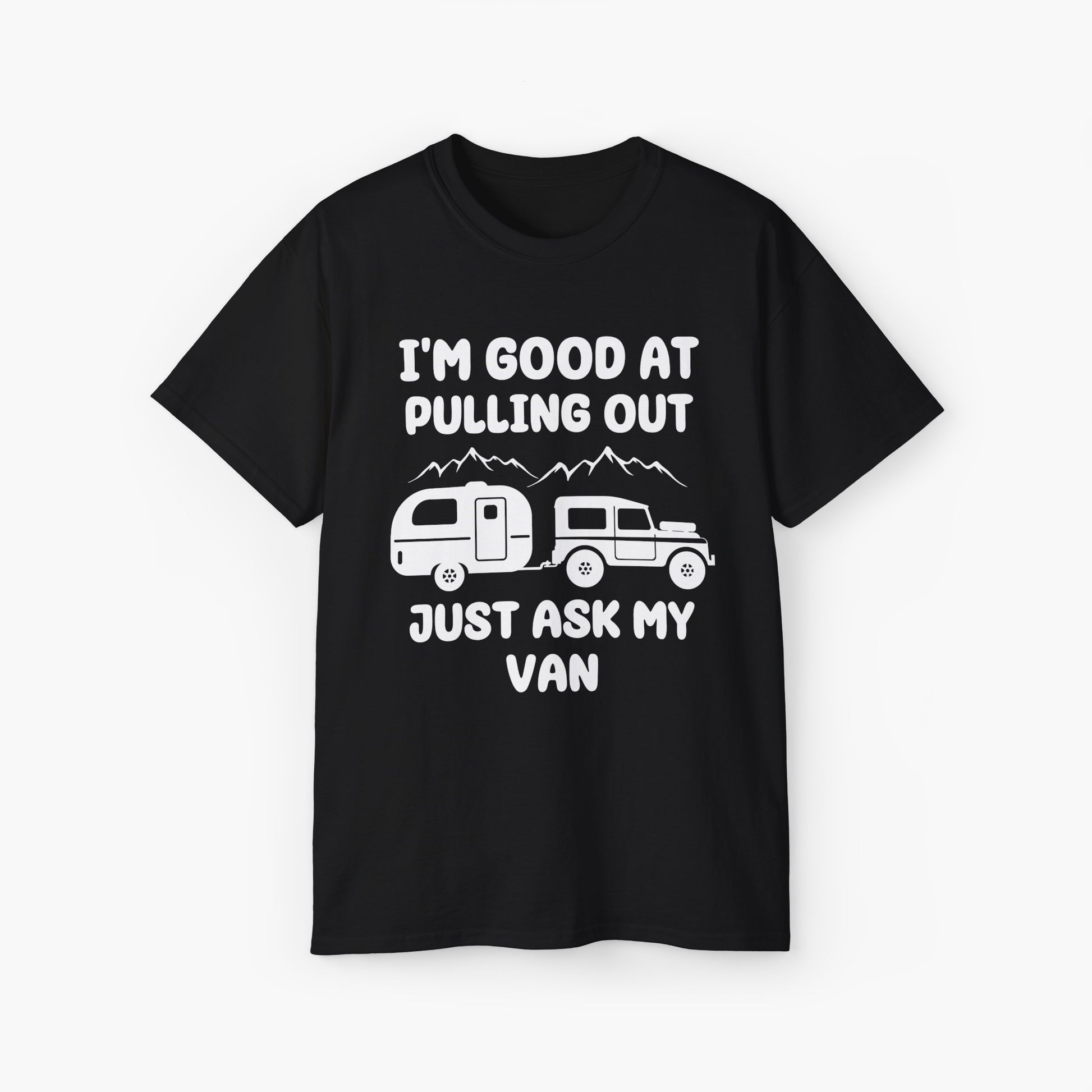 Black t-shirt with humorous text 'I'm good at pulling out, just ask my van,' featuring an image of a truck pulling a camping van, set against mountains on a plain background.
