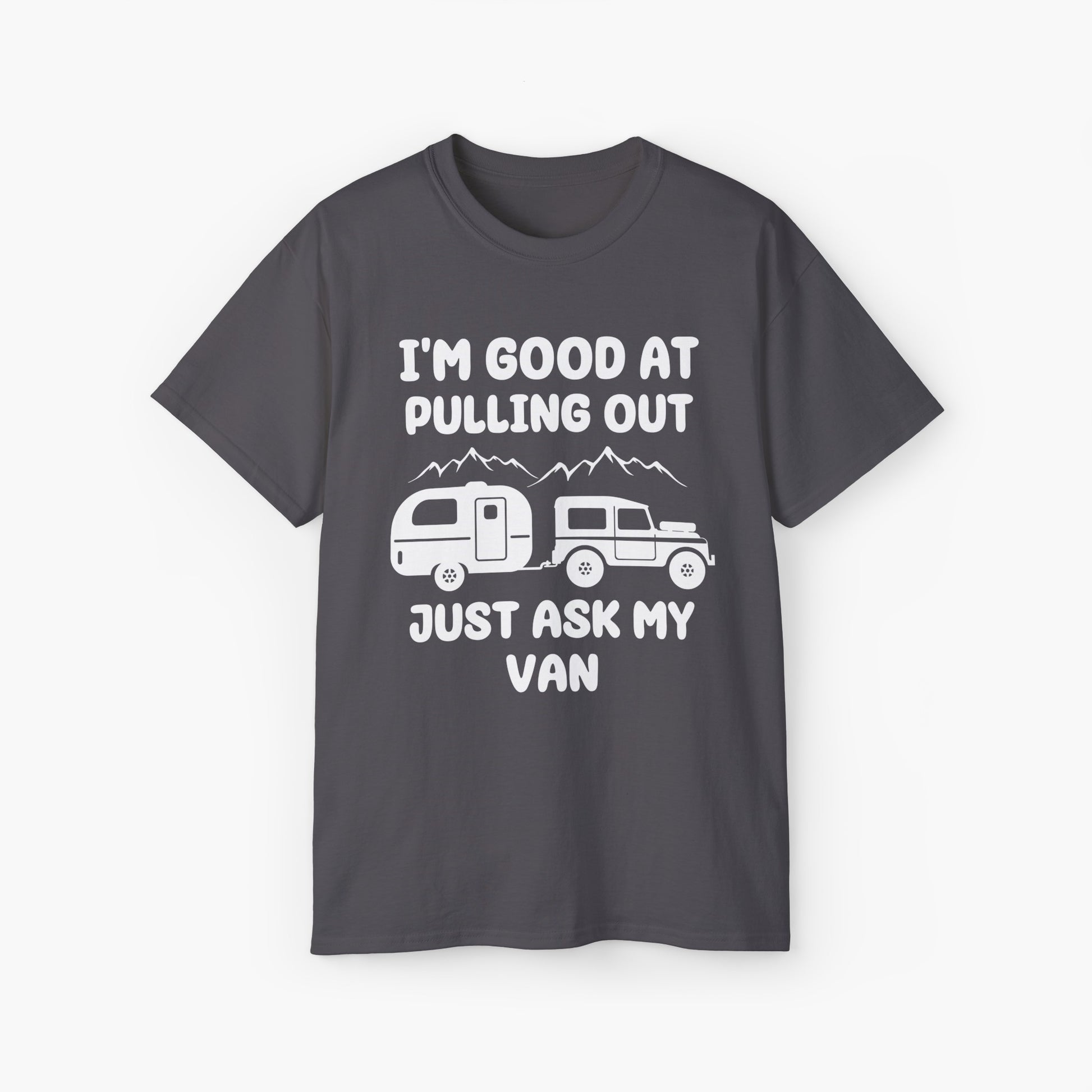 Dark grey t-shirt with humorous text 'I'm good at pulling out, just ask my van,' featuring an image of a truck pulling a camping van, set against mountains on a plain background.