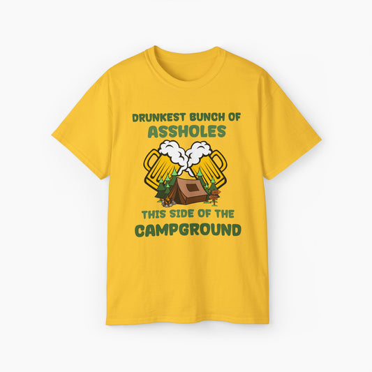 Yellow t-shirt with green text reading 'Drunkest bunch of assholes, this side of the campground,' featuring two glass of a beer, tent, and trees on a plain background.