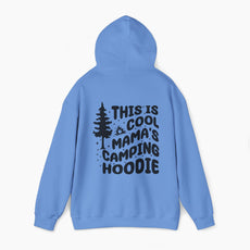 Blue hoodie with the text 'This is cool mama's camping hoodie' on the back, featuring a tree and stars design on a plain background.