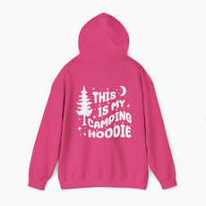 Back of pink hoodie featuring the text 'This is my camping hoodie,' with a design of a camping van, moon, stars, and a tree on a plain background.