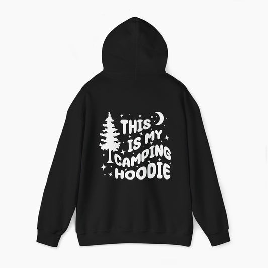 Back of a black hoodie featuring the text 'This is my camping hoodie,' with a design of a camping van, moon, stars, and a tree on a plain background.