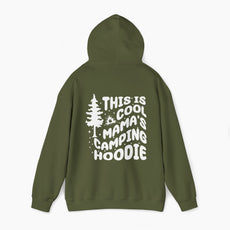 Military green hoodie with the text 'This is cool mama's camping hoodie' on the back, featuring a tree and stars design on a plain background.