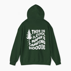 Green hoodie with the text 'This is cool mama's camping hoodie' on the back, featuring a tree and stars design on a plain background.
