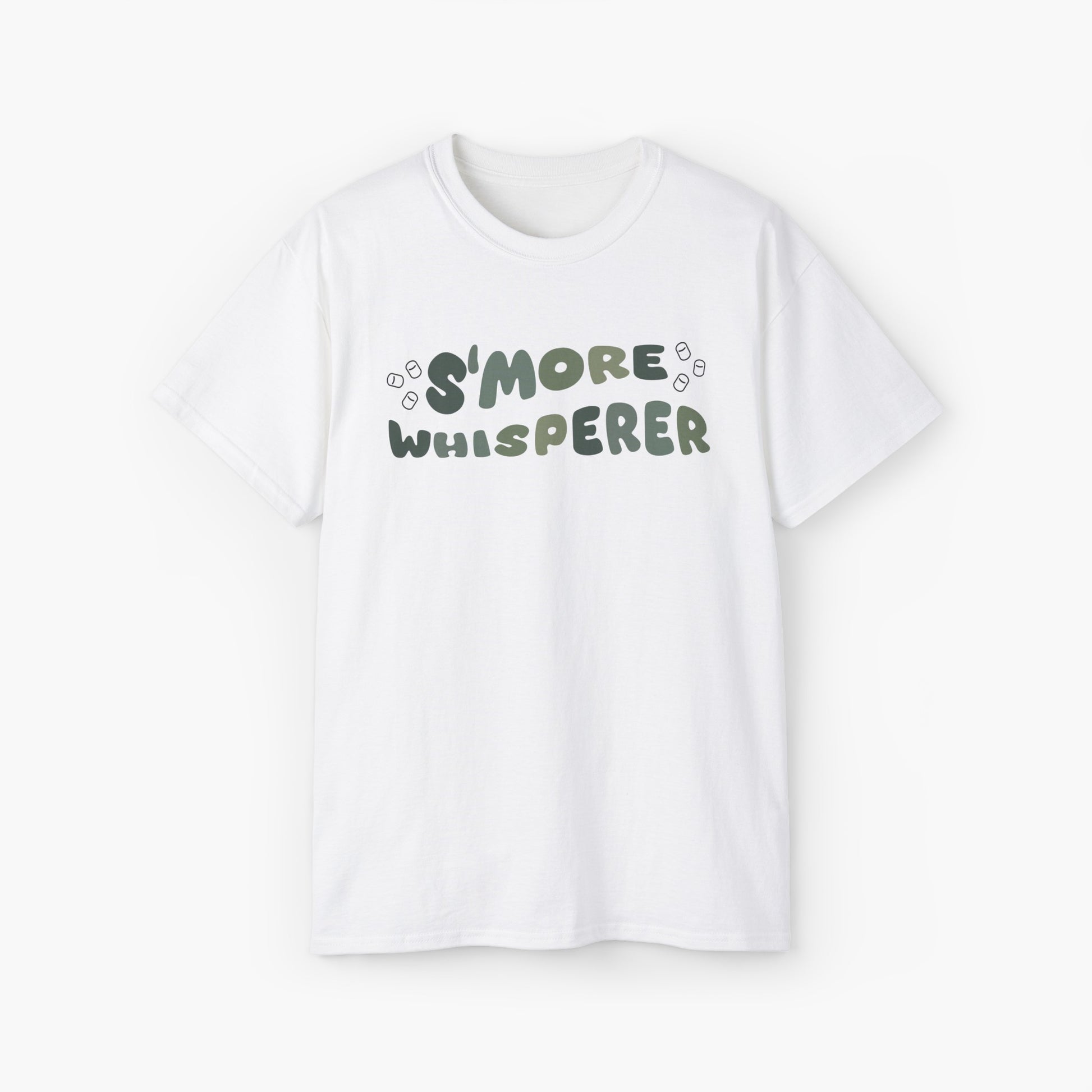 White t-shirt with green text 'S'more Whisperer' and marshmallow graphics on a plain background.