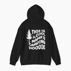 Black hoodie with the text 'This is cool mama's camping hoodie' on the back, featuring a tree and stars design on a plain background.