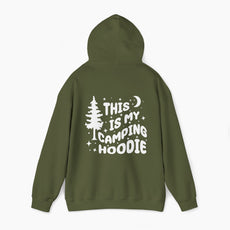 Back of military green hoodie featuring the text 'This is my camping hoodie,' with a design of a camping van, moon, stars, and a tree on a plain background.