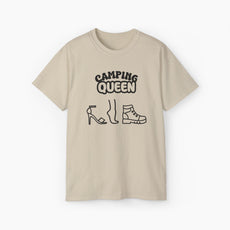 Sand color t-shirt with 'Camping Queen' text, illustrated with a high heel, a foot, and a boot, on a plain background.