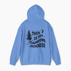 Back of blue hoodie featuring the text 'This is my camping hoodie,' with a design of a camping van, moon, stars, and a tree on a plain background.