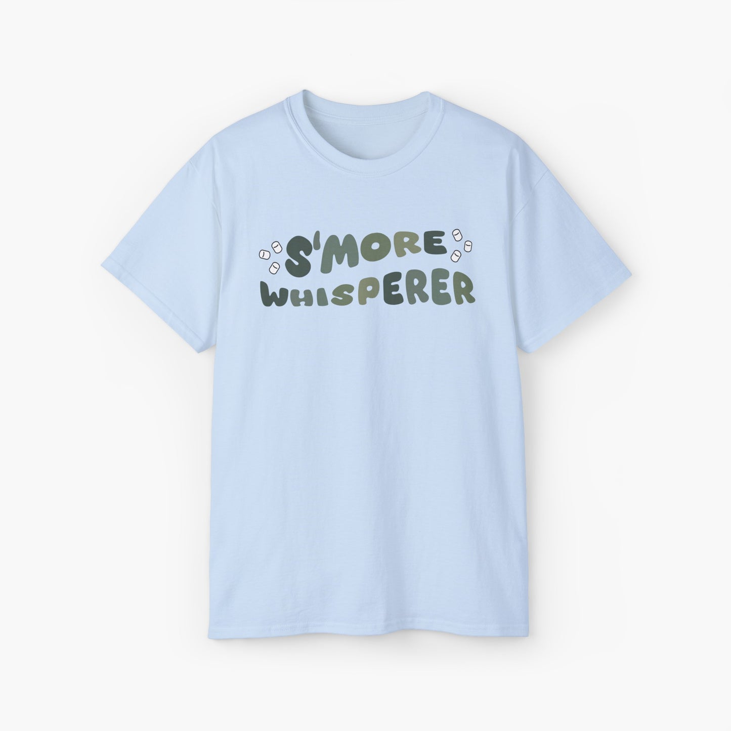 Light blue t-shirt with green text 'S'more Whisperer' and marshmallow graphics on a plain background.