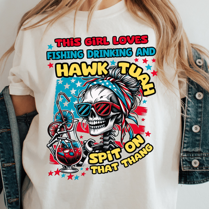 Woman wearing a white t-shirt with a colorful skeleton graphic in sunglasses, holding a drink, and the text 'This Girl Loves Fishing, Drinking and Hawk Tuah, Spit on That Thang